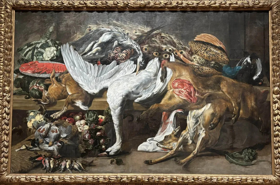 A still life oil painting depicting several dead animals on a table, including a swan, a peacock, a lobster, a rabbit (or perhaps a hare), a boar, a young deer, several doves or pigeons, and numerous small birds. One of the boar's legs is broken; its belly is sliced open, revealing glistening red meat within.